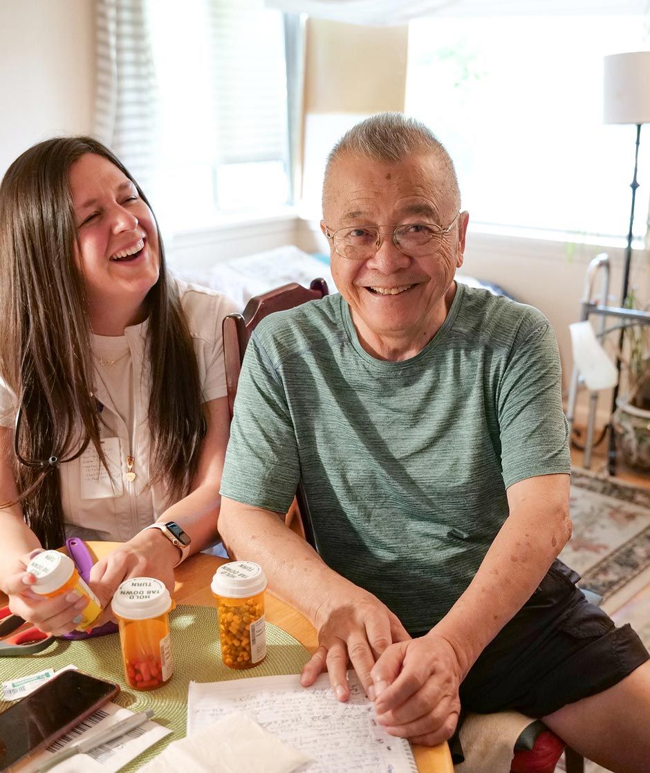 CNS Home Health & Hospice, home care in West Valley City, UT — Smiling senior and caregiver at a dining table
