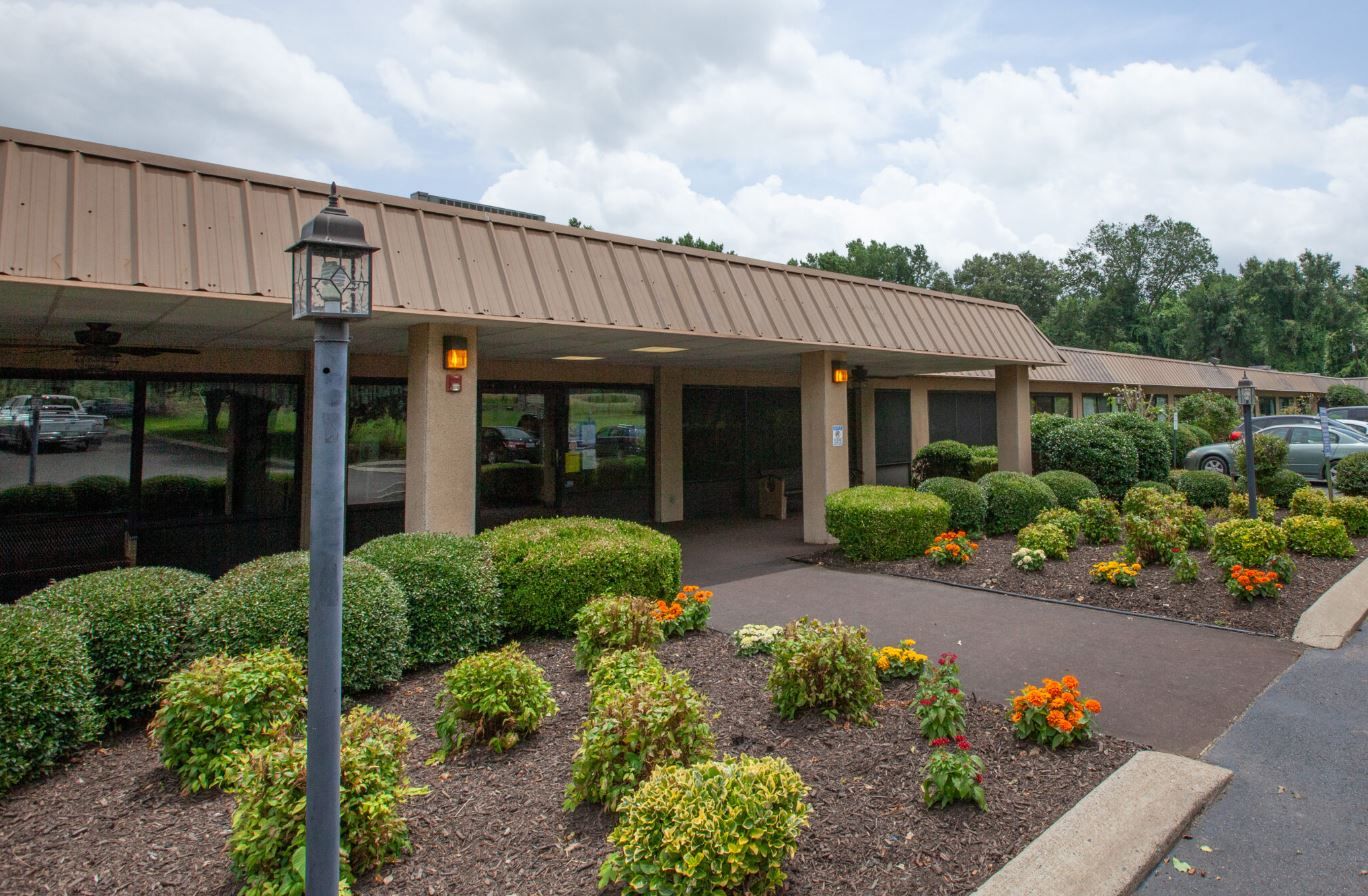 Exterior view of the assisted living facility with landscaping