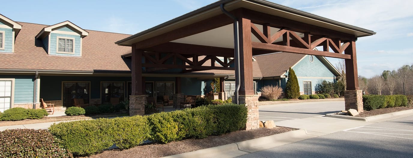 Exterior view of Autumn Care of Fayetteville with entrance area