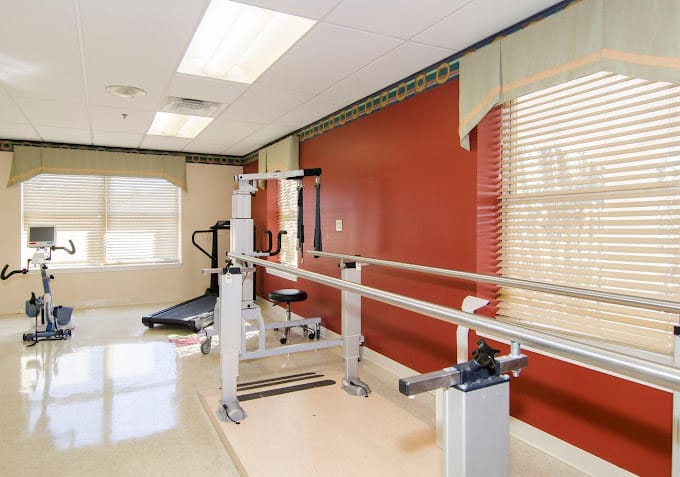 Therapy room with exercise equipment and rehabilitation tools