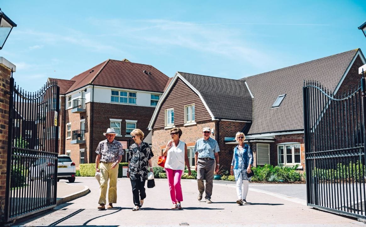 Residents walking through the entrance of Durrants Village