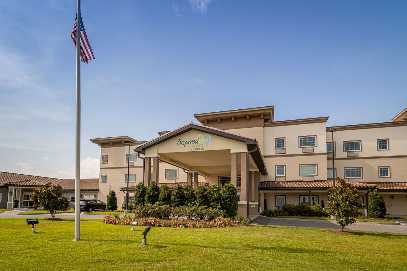 Exterior view of the assisted living facility with landscaping