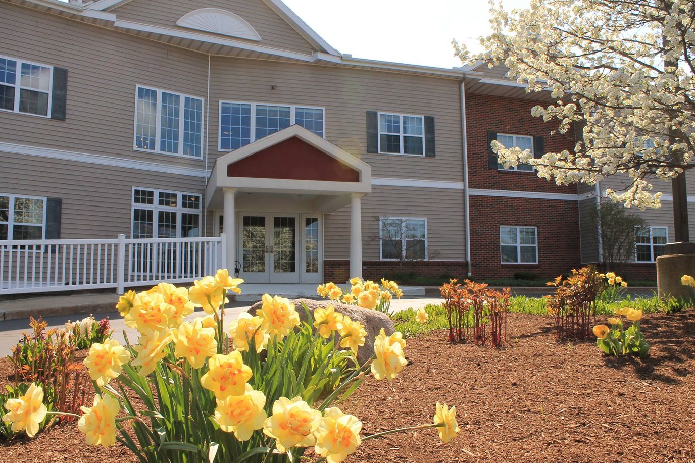 Front entrance of Memory Garden with blooming flowers