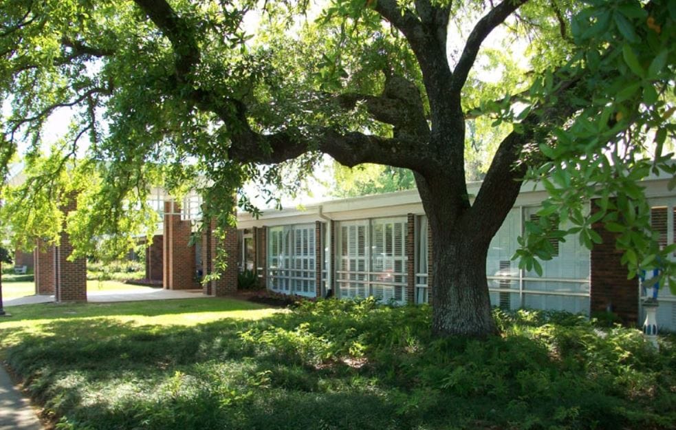 Exterior view of the nursing and rehabilitation center with trees
