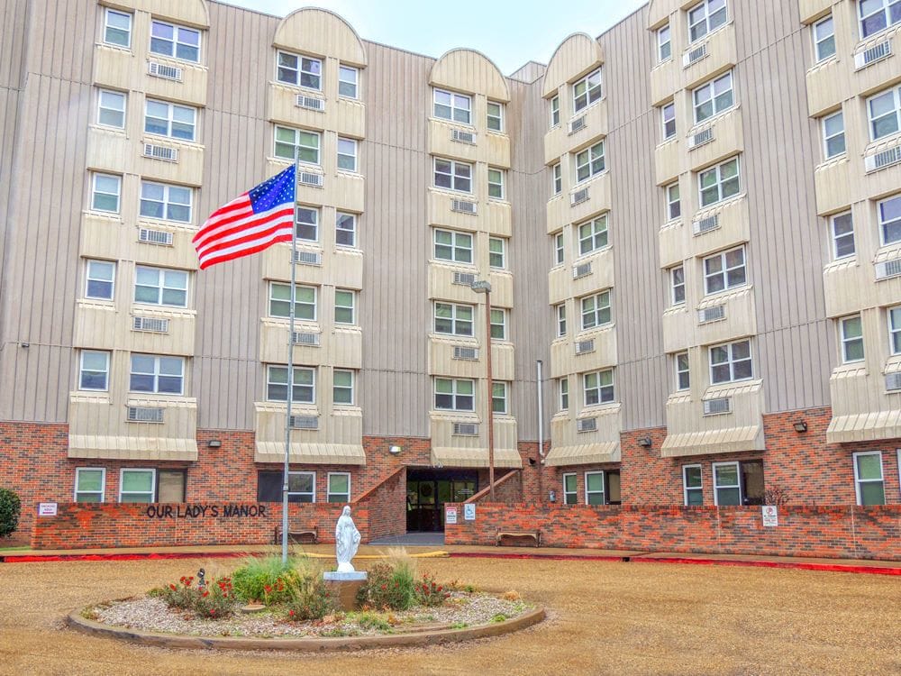 Exterior view of Our Lady's Manor with flag