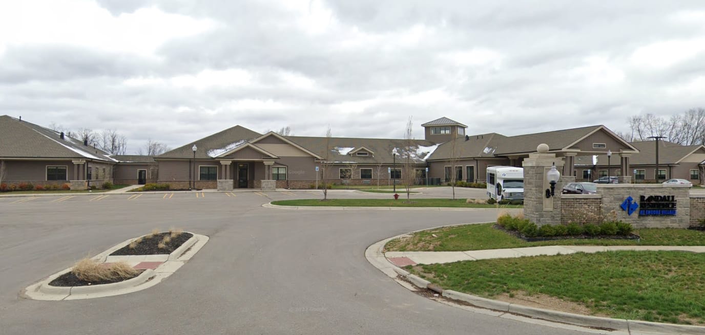 Exterior view of Assisted Living facility with parking