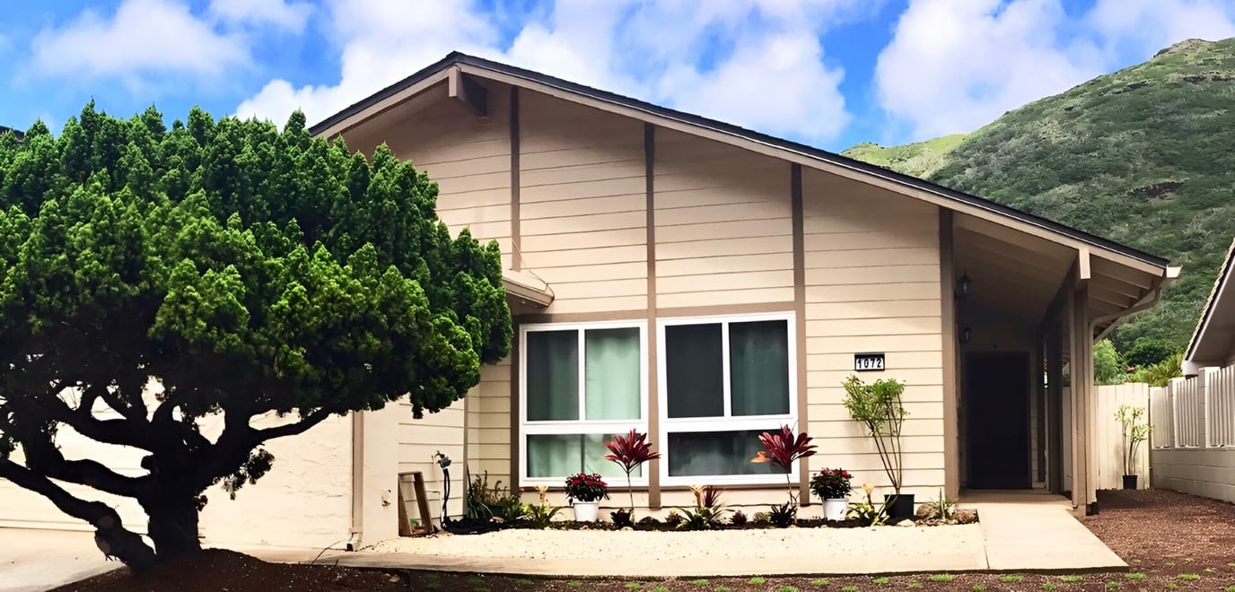 Exterior view of Serenity Care Home with landscaping