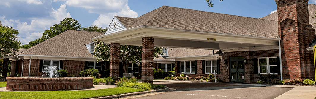 Exterior view of Village Green Health & Rehabilitation building