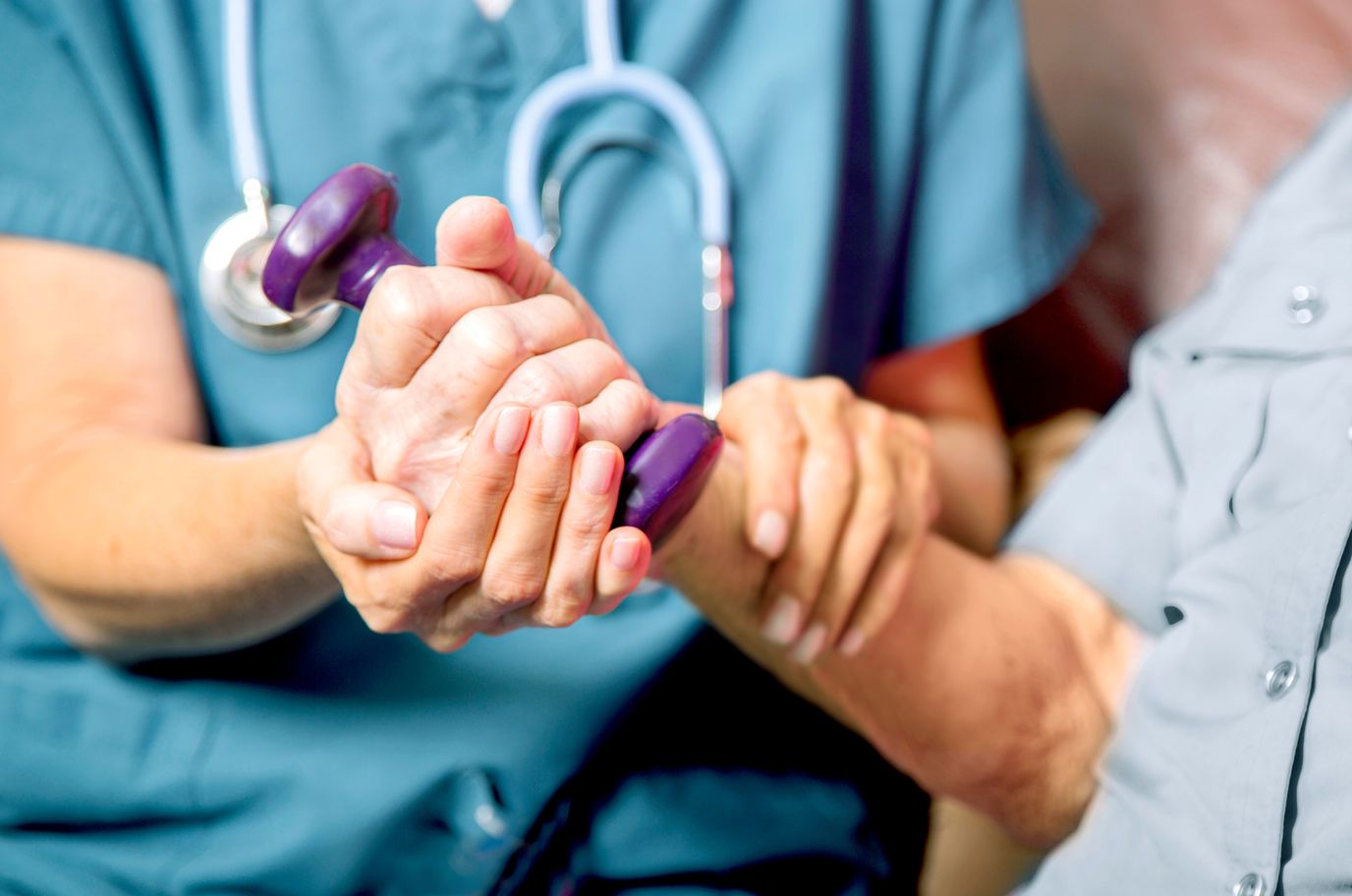 Holy Family Care Home, home care in Kaneohe, HI — Hands assisting with physical therapy exercises