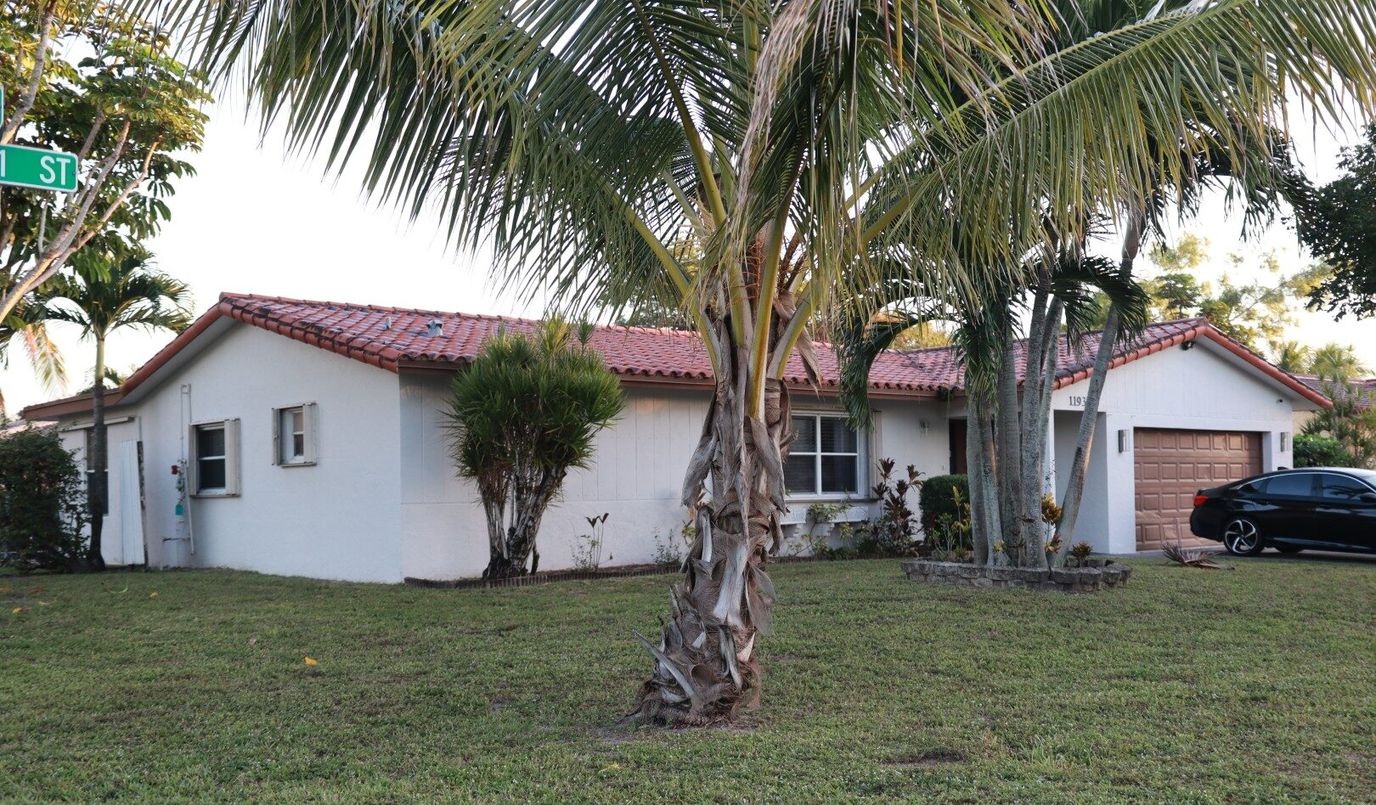 Exterior view of a senior living facility with landscaping