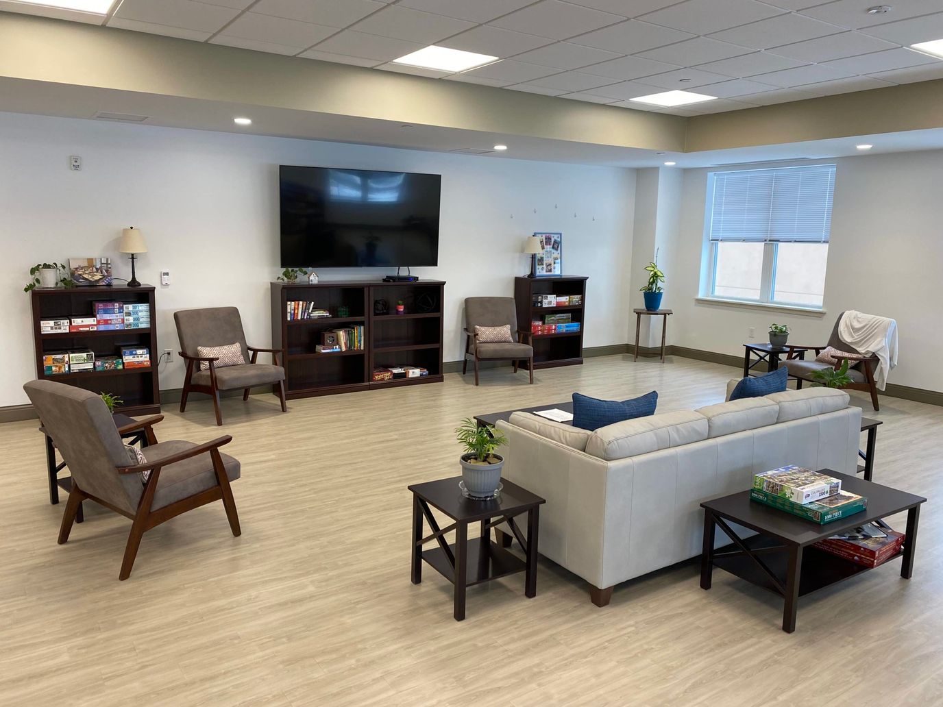 Bright common area with seating and games
