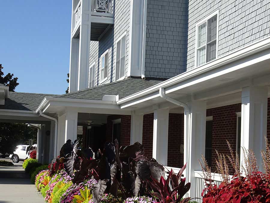 Exterior view of the facility with colorful flowers