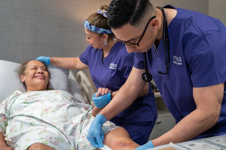 Healthcare professionals attending to a resident