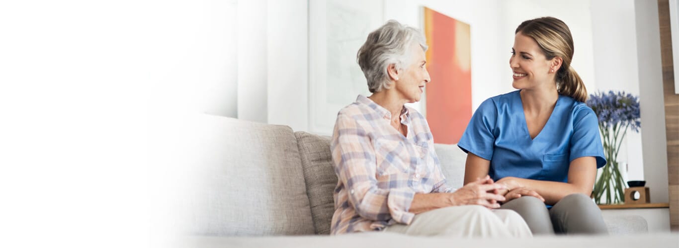 All Ways Caring HomeCare – Missoula, home care in Missoula, MT — Caregiver interacting with senior resident in cozy setting
