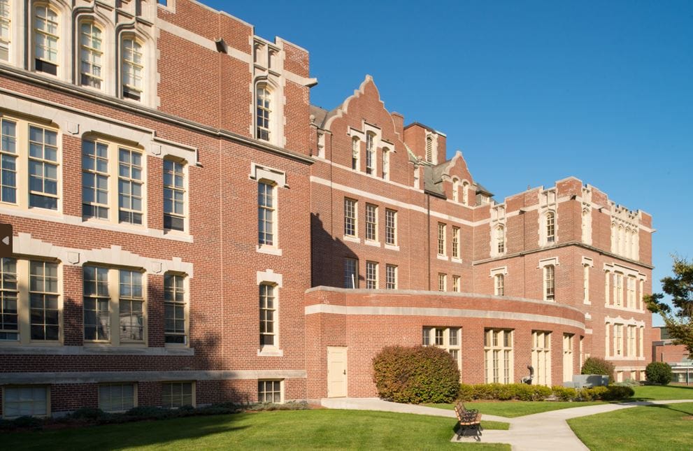 Exterior view of Brigham House facility with clear blue sky
