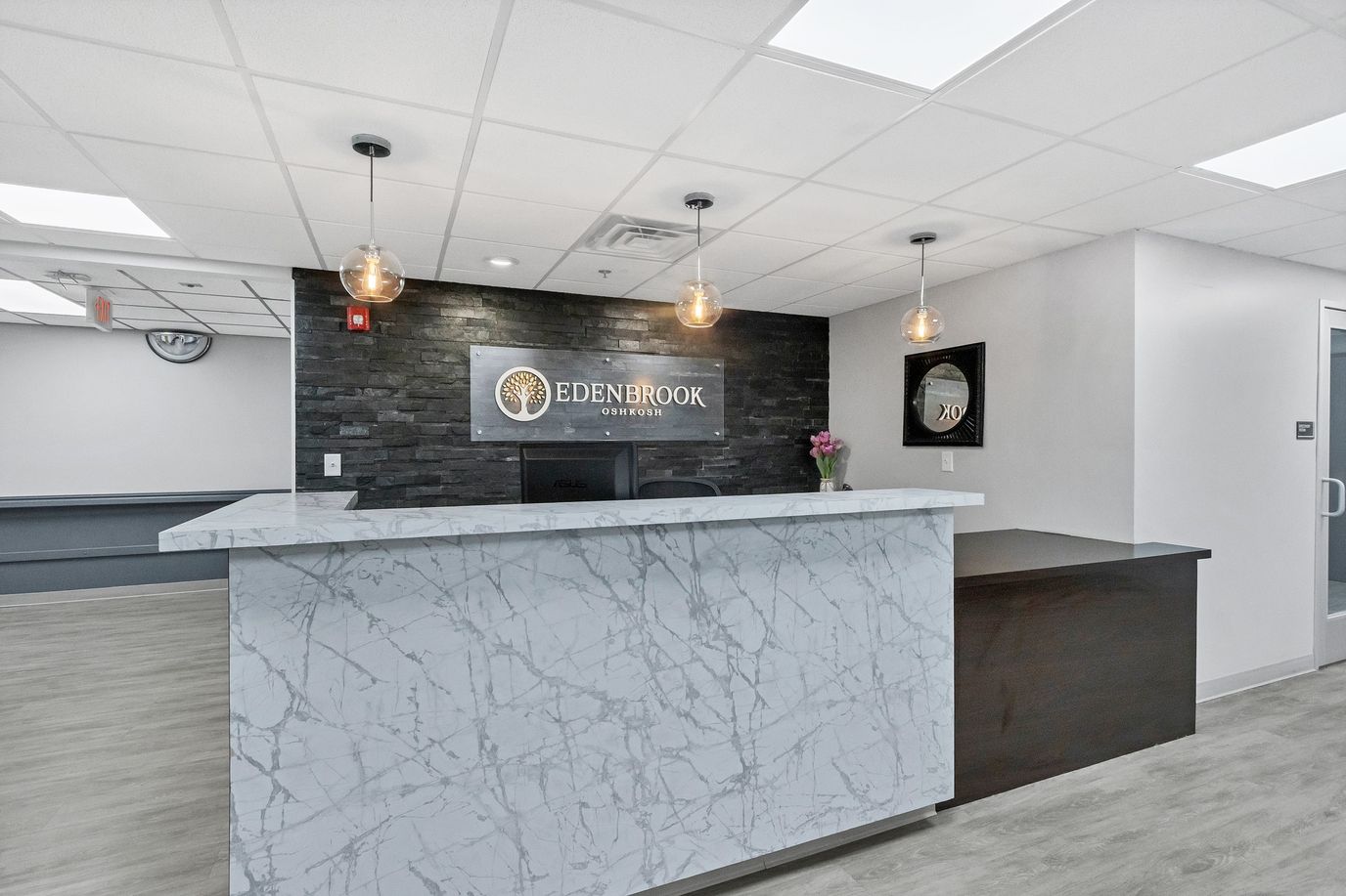 Modern reception area with facility logo