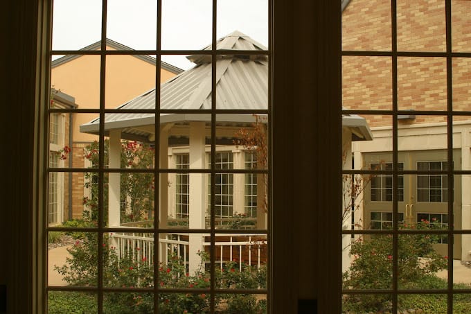 View of a gazebo in a courtyard through a window