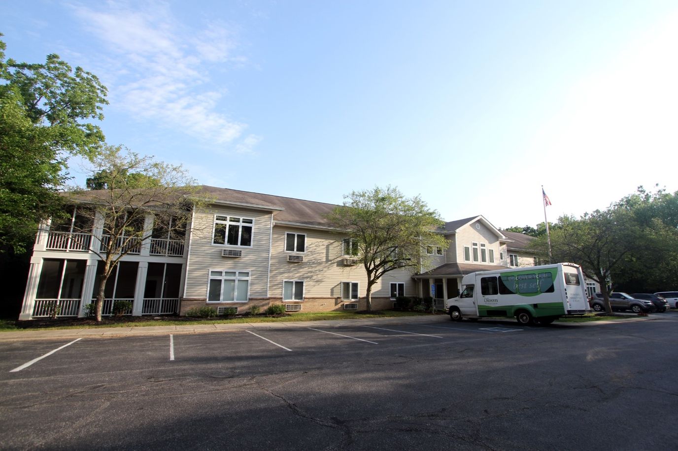 Exterior view of Bloom At Eagle Creek facility with transport van