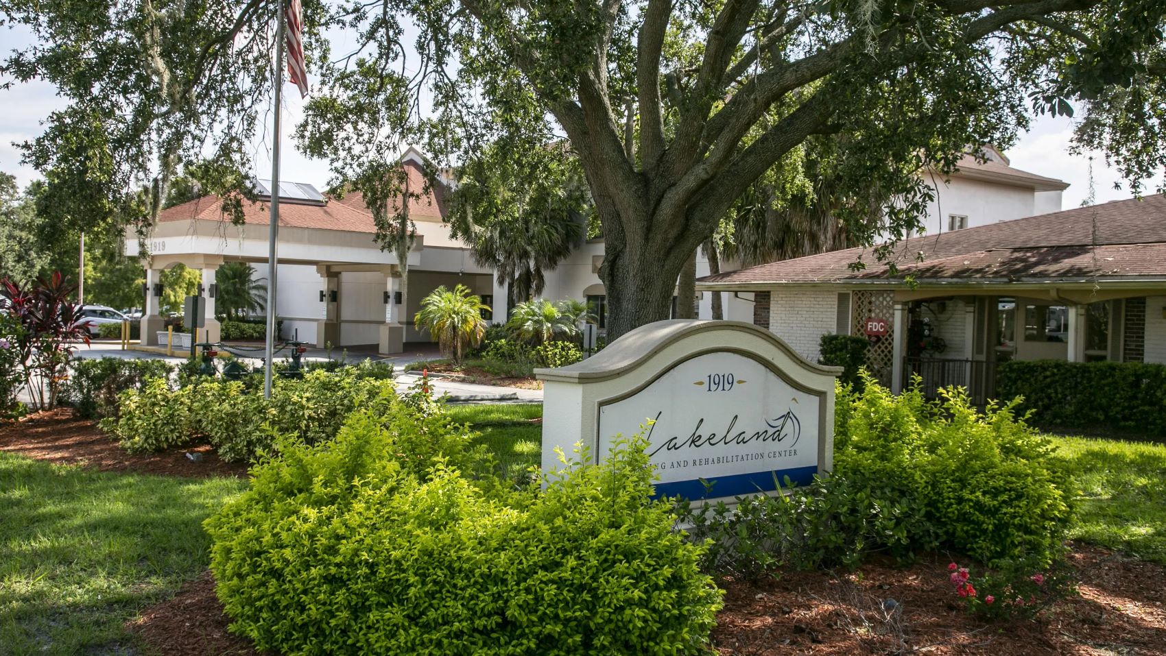 Exterior view of Lakeland Nursing and Rehabilitation Center's sign and building
