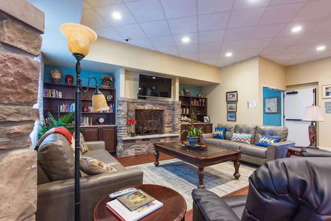 Comfortable common area with seating and a fireplace
