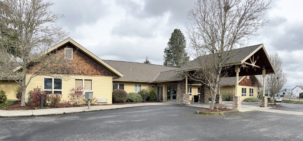 Exterior view of Ray Hickey Hospice House with landscaped entry