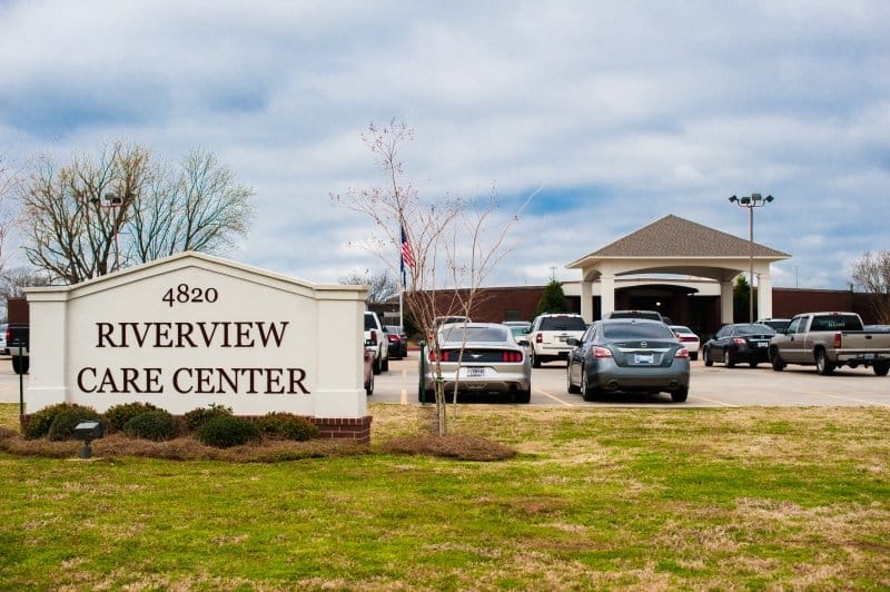Exterior view of Riverview Care Center with parking lot