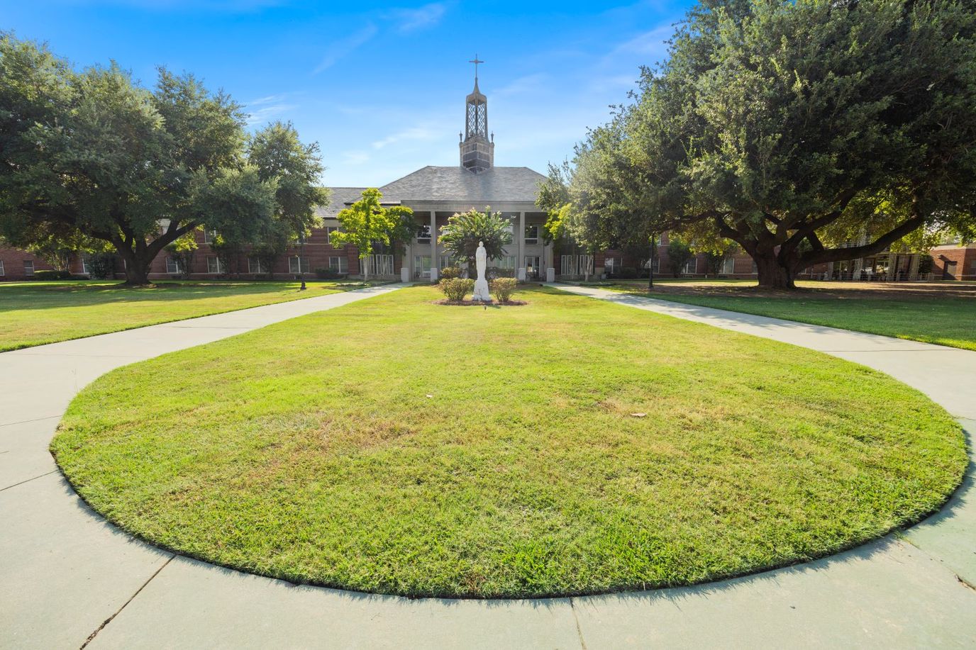 Well-maintained gardens and front entrance of St. Joseph's Assisted Living