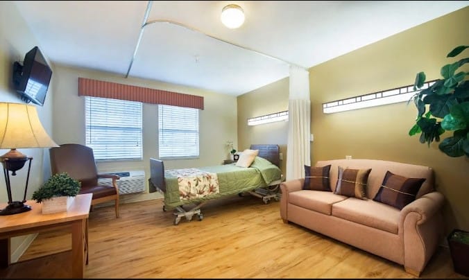 Cozy resident room with a bed and seating area