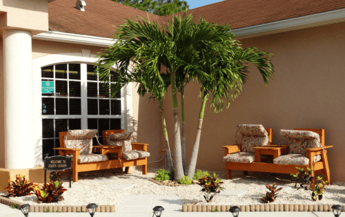 Outdoor seating area with tropical plants