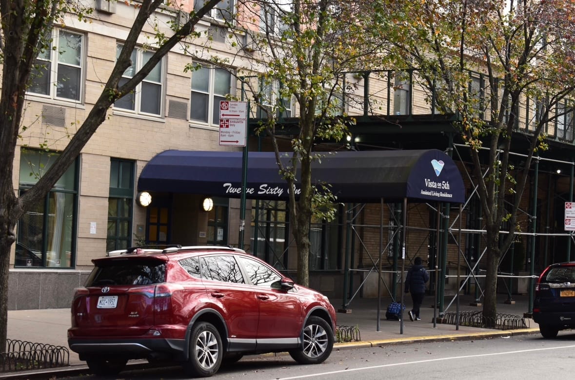 Front entrance of Vista on 5th with vehicle parked