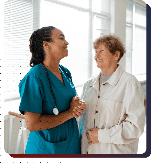 Staff interacting with a resident in a corridor