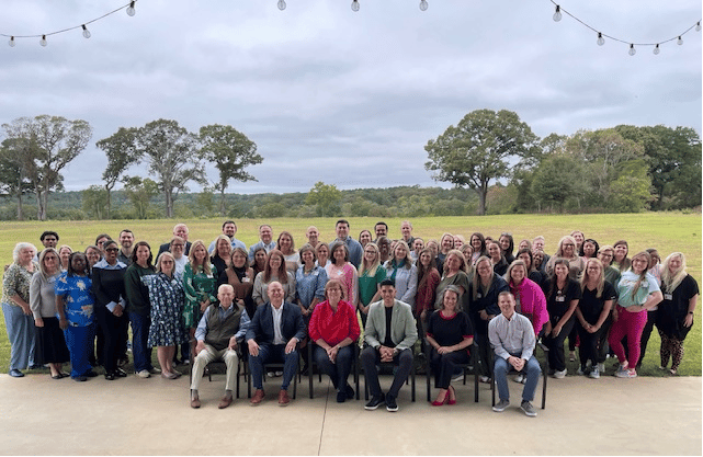 Group photo of staff members outdoors