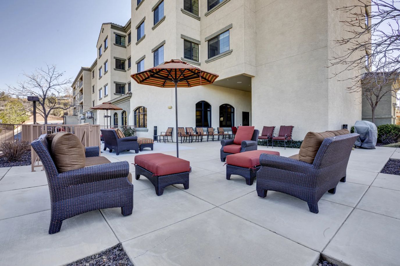 Outdoor seating area with stylish furniture and umbrellas