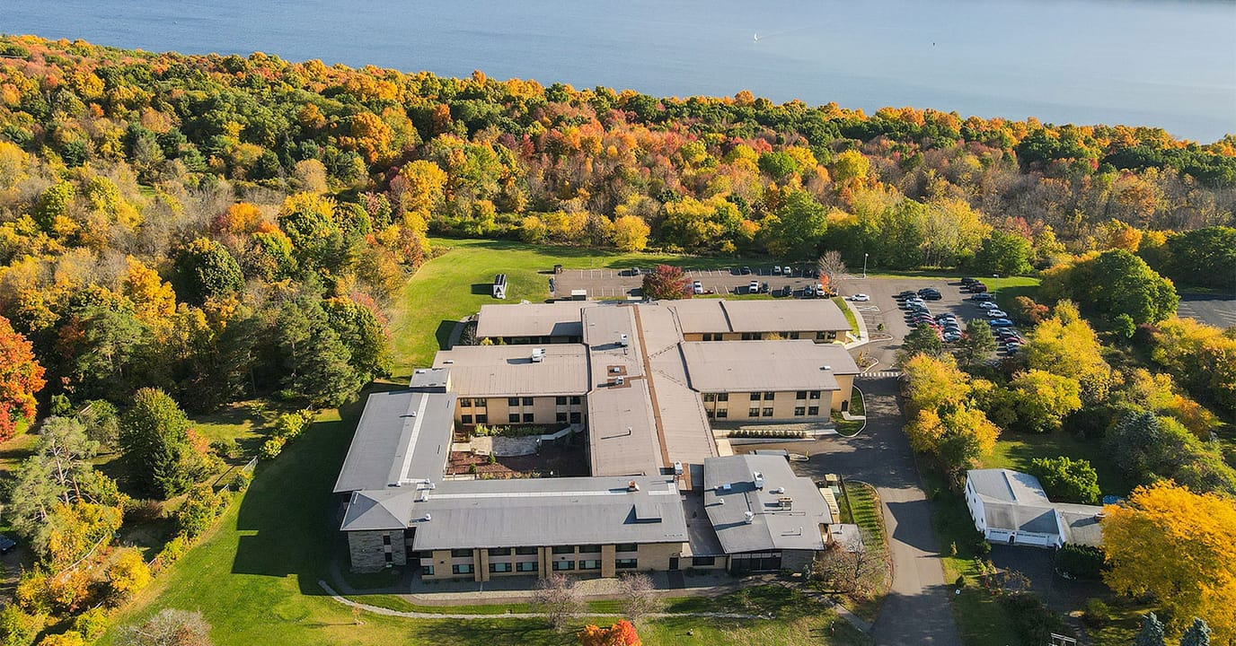 Aerial view of Cayuga Nursing & Rehabilitation Center surrounded by fall foliage