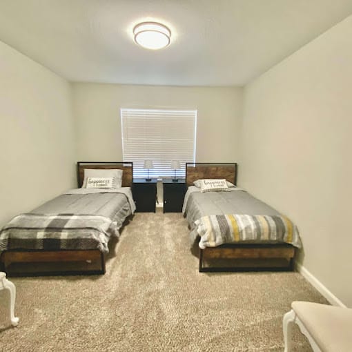 A cozy double bedroom in a senior living facility