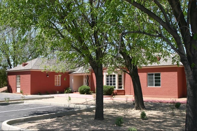 Exterior view of a red-brick assisted living facility