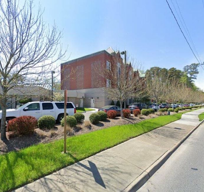 Hilton Plaza Inc., independent living in Newport News, VA — Exterior view of a senior living facility with landscaping