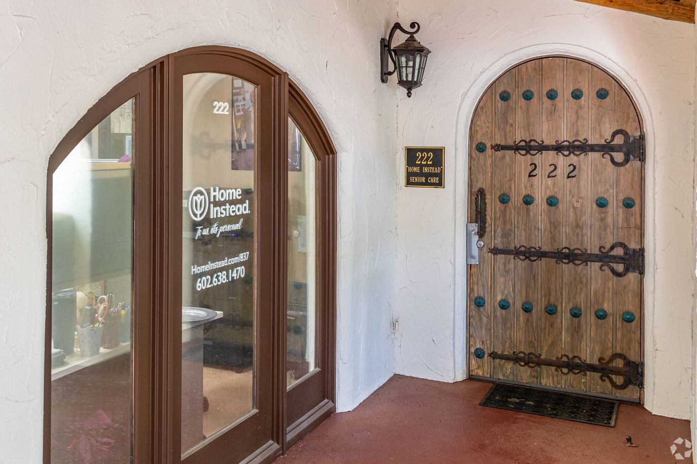 Entrance doors of the Home Instead facility with signage