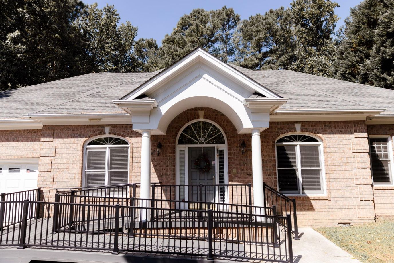 Front entrance of a brick building with ramp