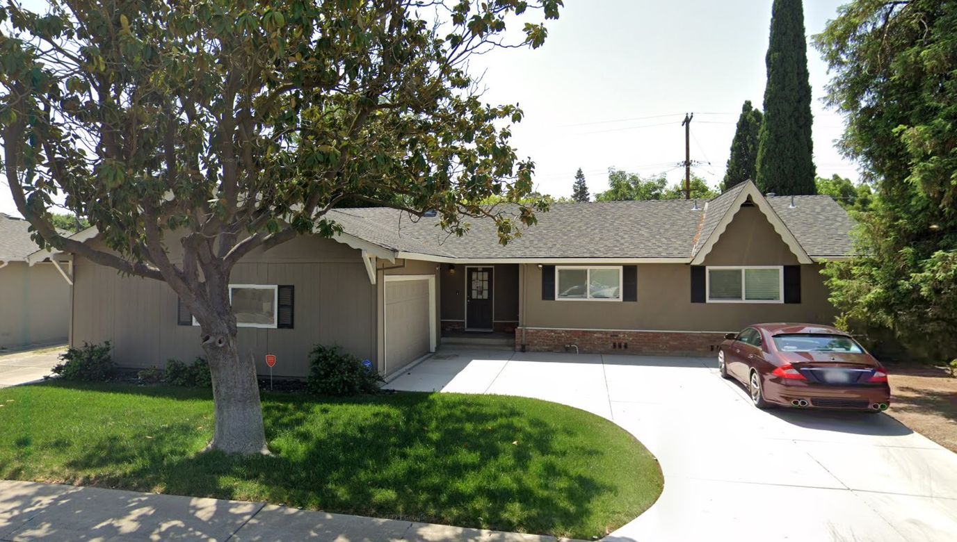Exterior view of a residential building with a driveway