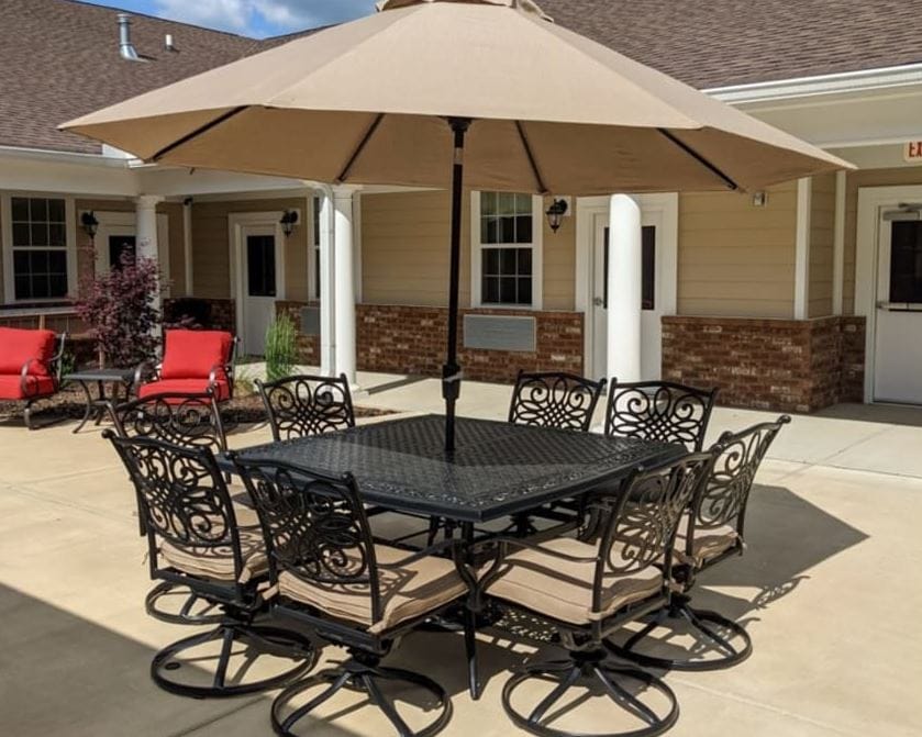 Outdoor dining area with seating and umbrella