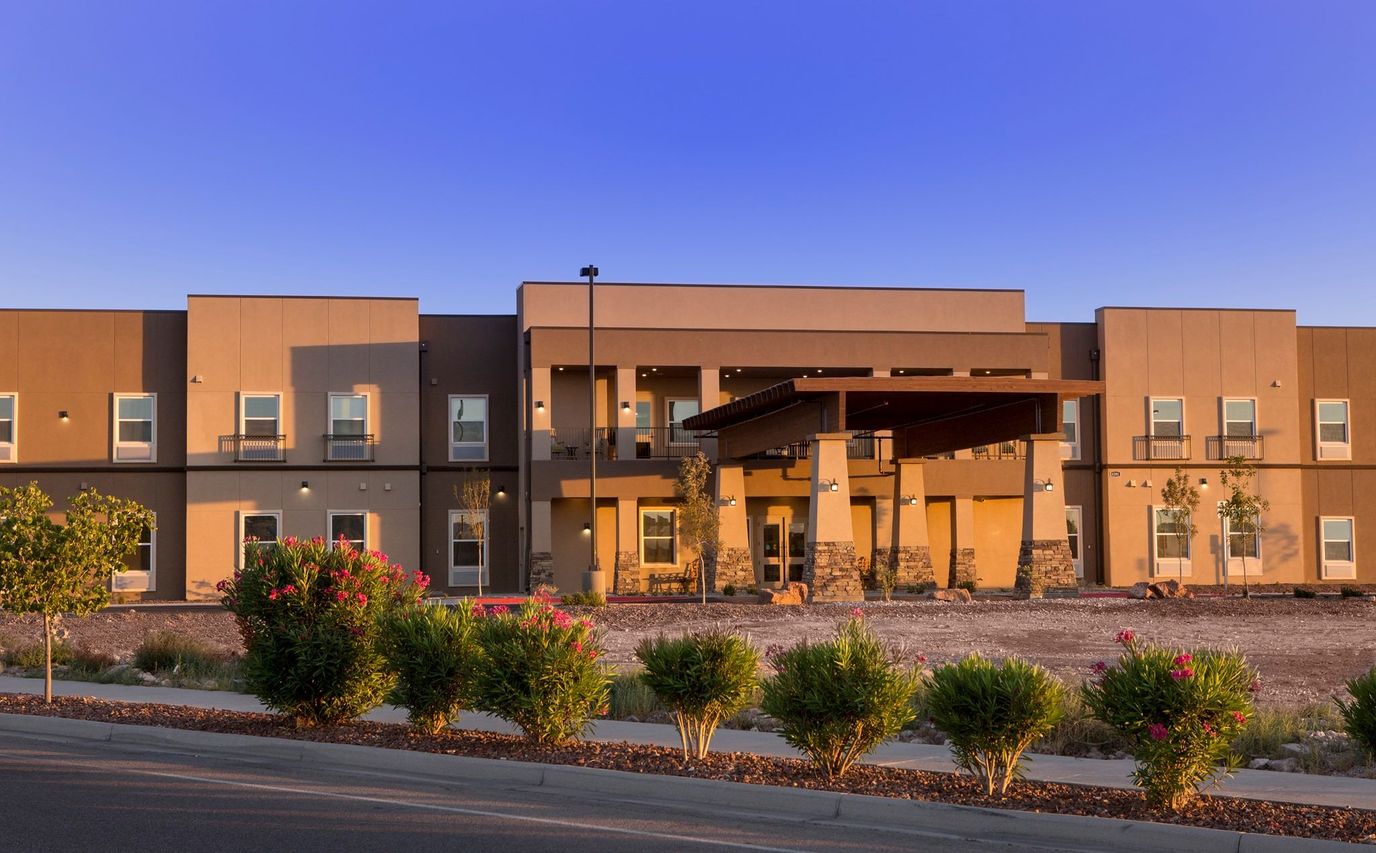 Exterior view of The Legacy at Cimarron with landscaped area