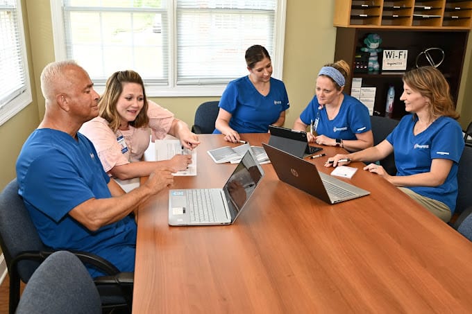Staff collaborating in a conference room