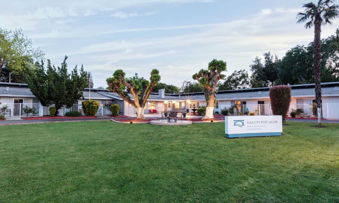 Exterior view of Yuba City Post-Acute facility with landscaped garden