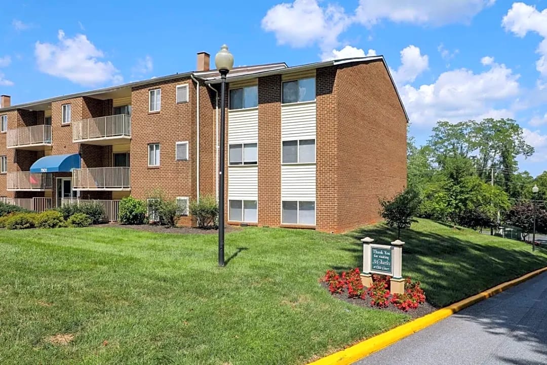 Exterior view of St. Charles House Apartments with landscaping
