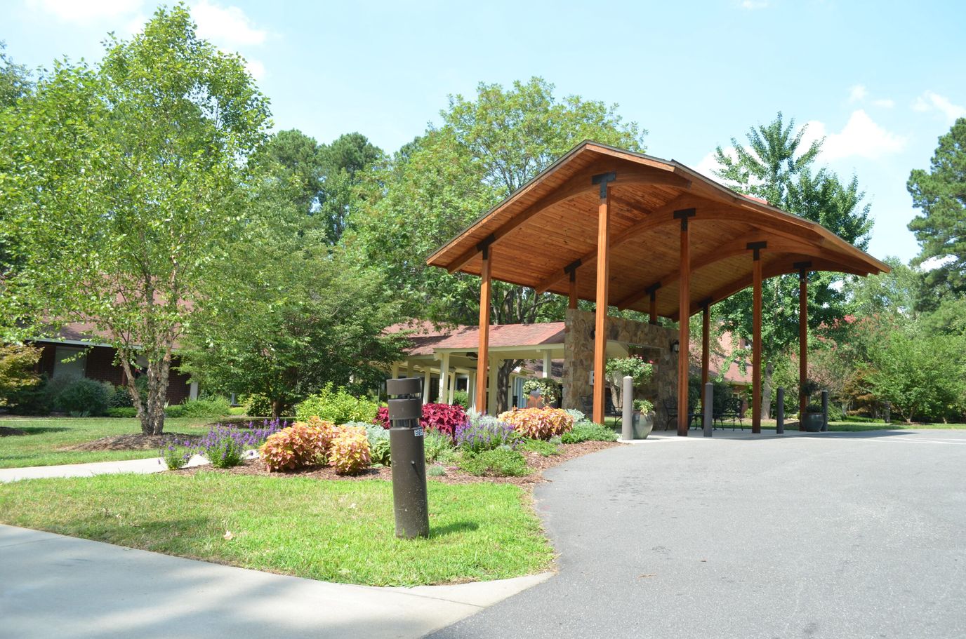 Entrance of a senior living facility with landscaping