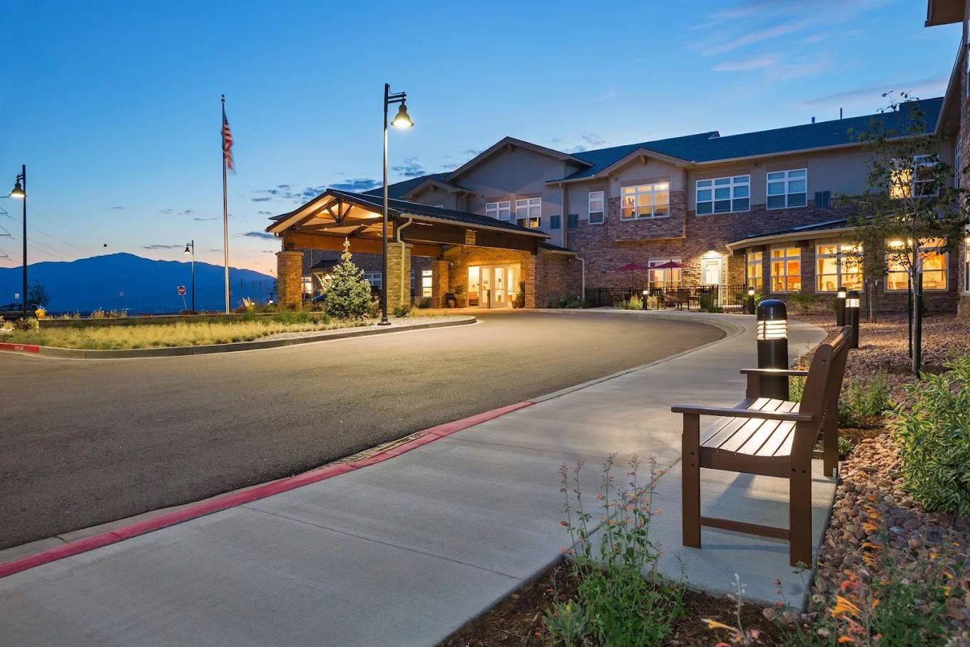 Exterior view of Melody Living Colorado Springs at dusk