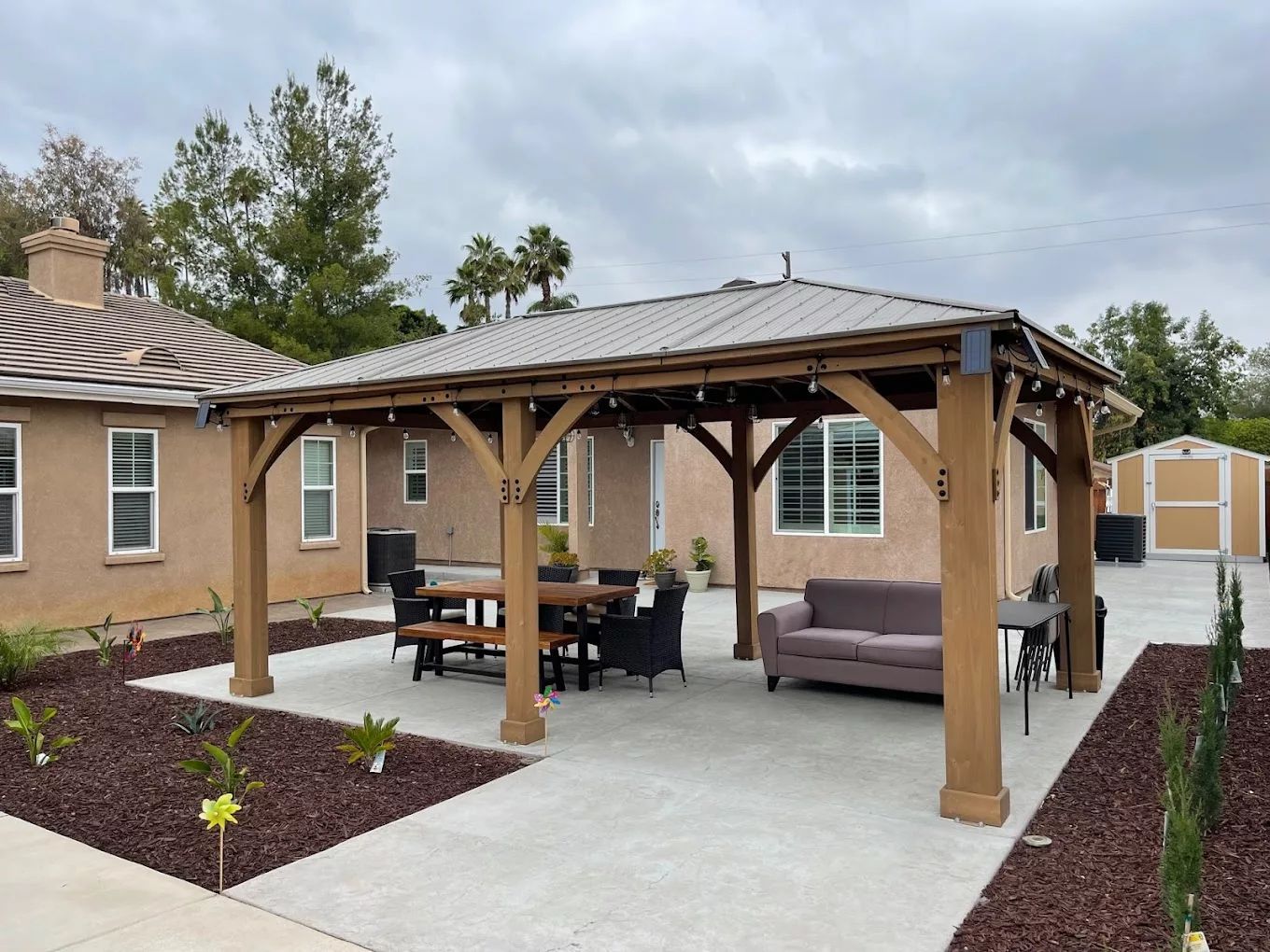 Outdoor seating area with a gazebo and dining table