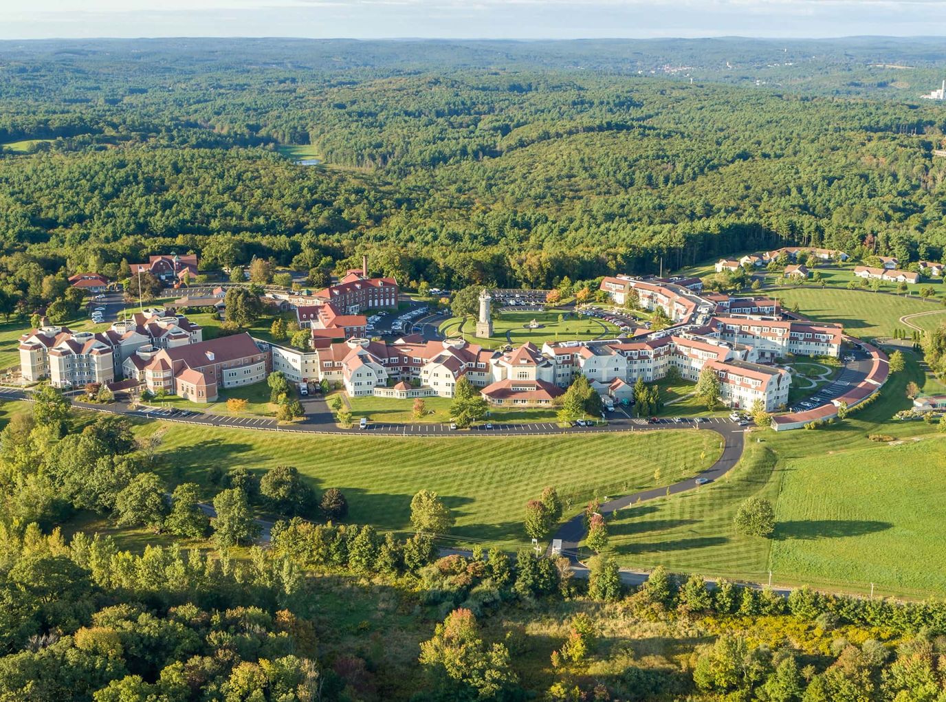 Aerial view of a large senior living campus with gardens