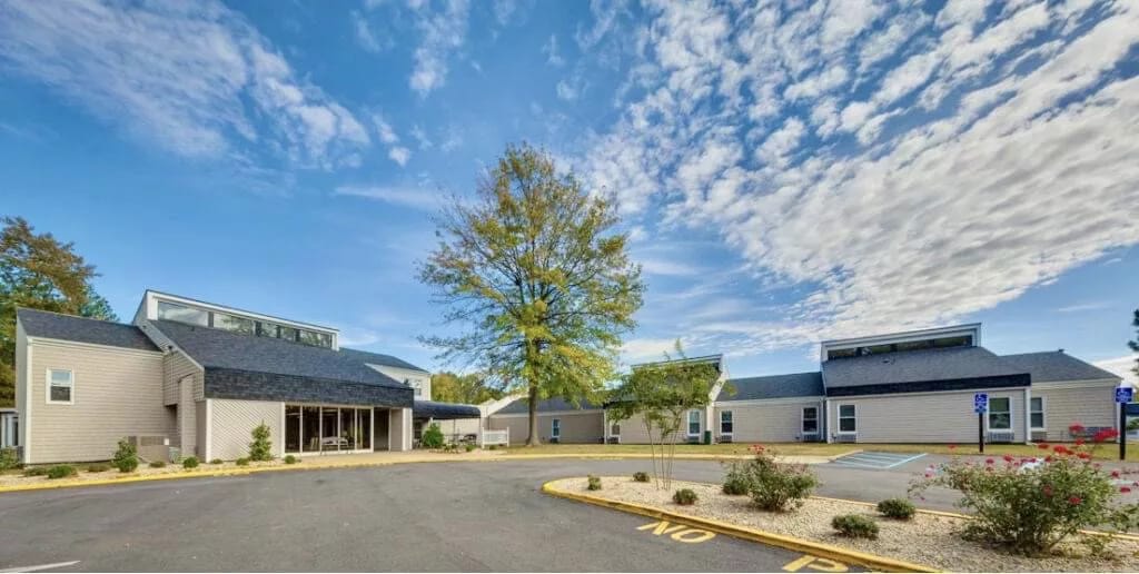 Exterior view of Parson Residential Care's building and landscape